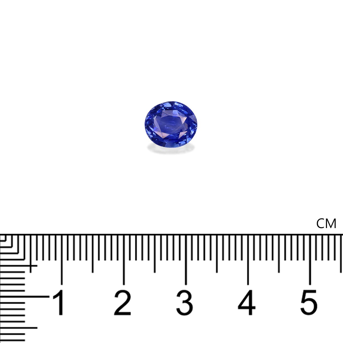 Une pierre précieuse Saphir Bleu de Bonnot Paris, pesant 2,27 ct et mesurant environ 0,8 à 1 cm, est présentée sur un fond blanc avec une règle centimétrique visible en dessous.