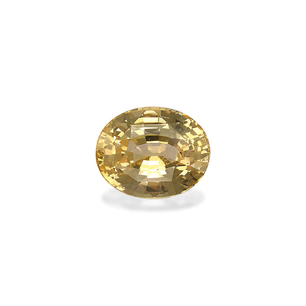 Le Saphir Jaune · 6,02ct de Bonnot Paris est une pierre précieuse jaune ronde, taille brillant, facettée, avec une surface réfléchissante et des facettes scintillantes, sertie sur un fond blanc uni.