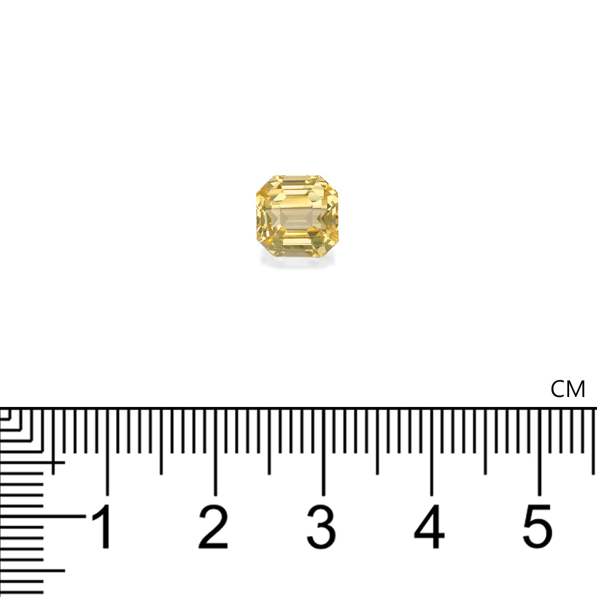 Le Saphir Jaune · 3,65ct de Bonnot Paris est une pierre précieuse octogonale jaune sertie sur un fond blanc, positionnée au-dessus d'une règle graduée en centimètres pour l'échelle.