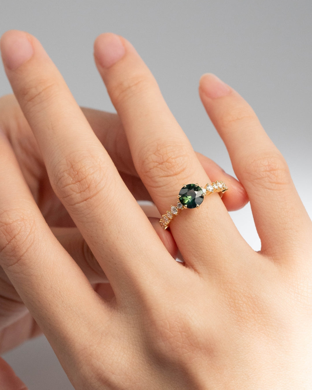 Engagement ring with green sapphire