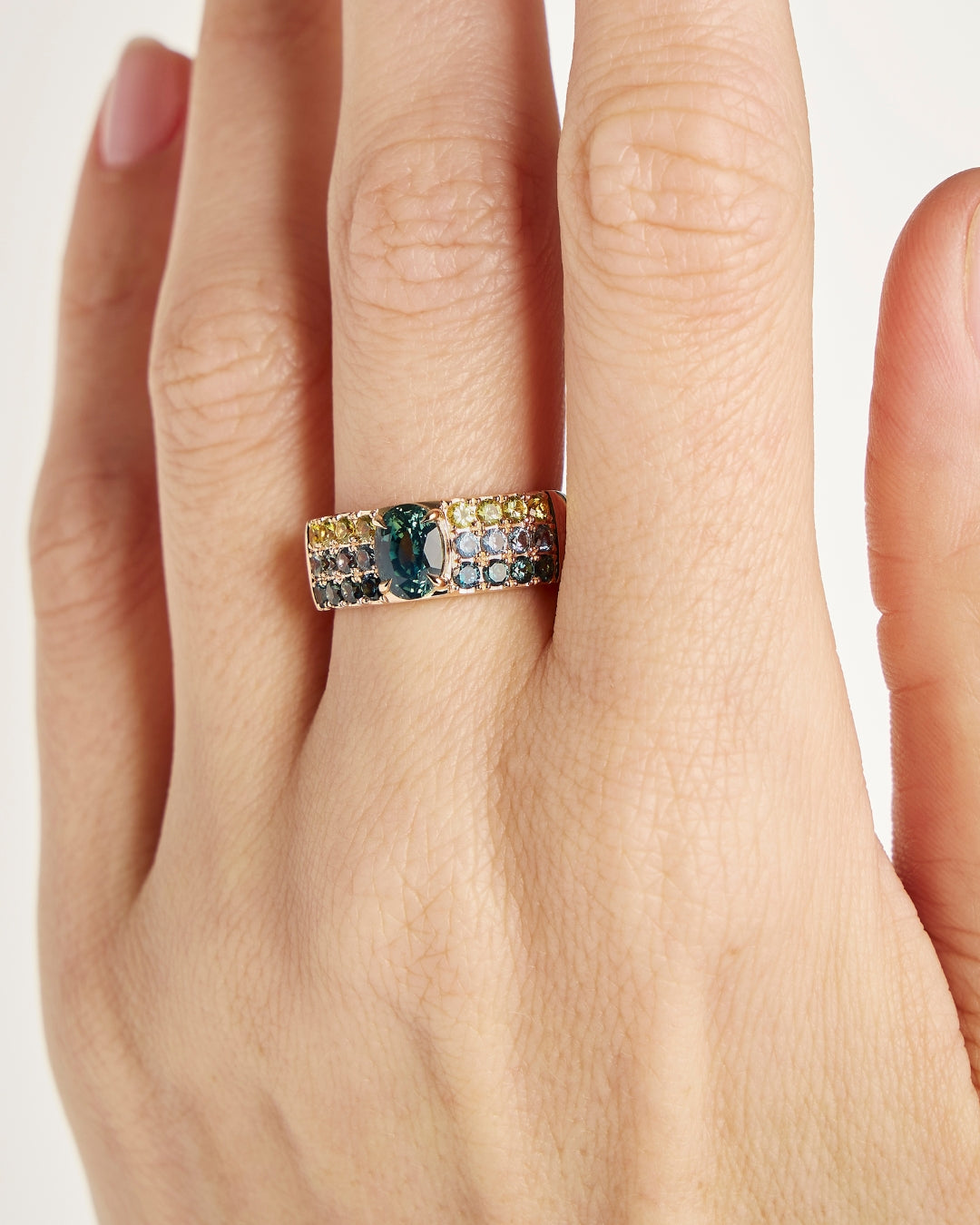 Engagement ring with teal sapphire