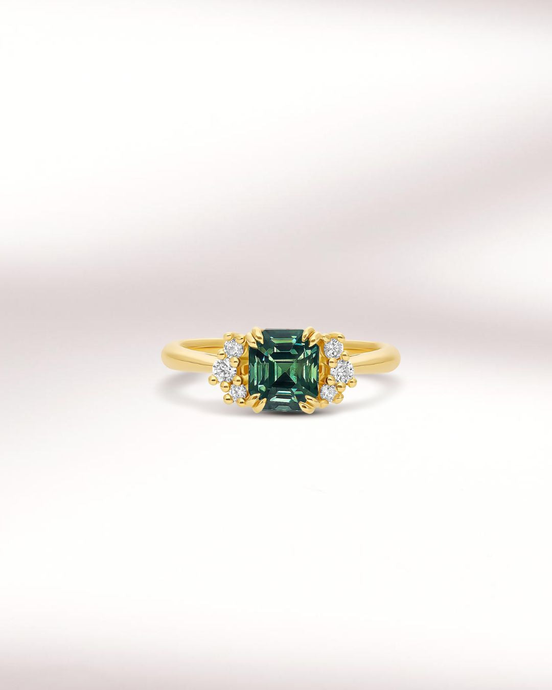 Engagement ring with teal sapphire