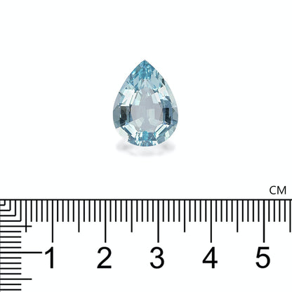 Une magnifique pierre d'Aigue-Marine en forme de poire de Bonnot Paris repose sur un fond blanc. En dessous, une règle indique sa hauteur d'environ 1,5 cm, soulignant l'élégance de cette pièce de 7,38 carats digne d'un bijou.