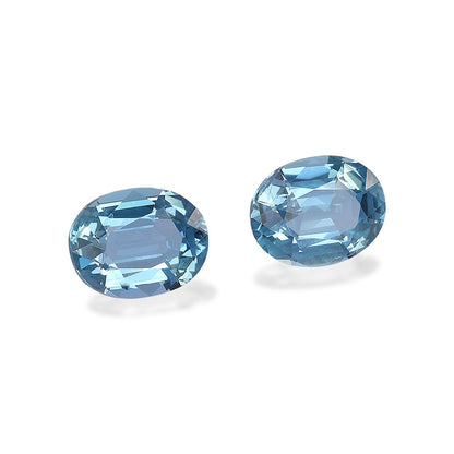 Les pierres précieuses Aigue-Marine Bonnot Paris, totalisant 1,64 ct et présentant une taille ovale qui rehausse leur éclat, sont présentées sur un fond blanc pour mettre en valeur leur clarté et leur couleur vibrante.