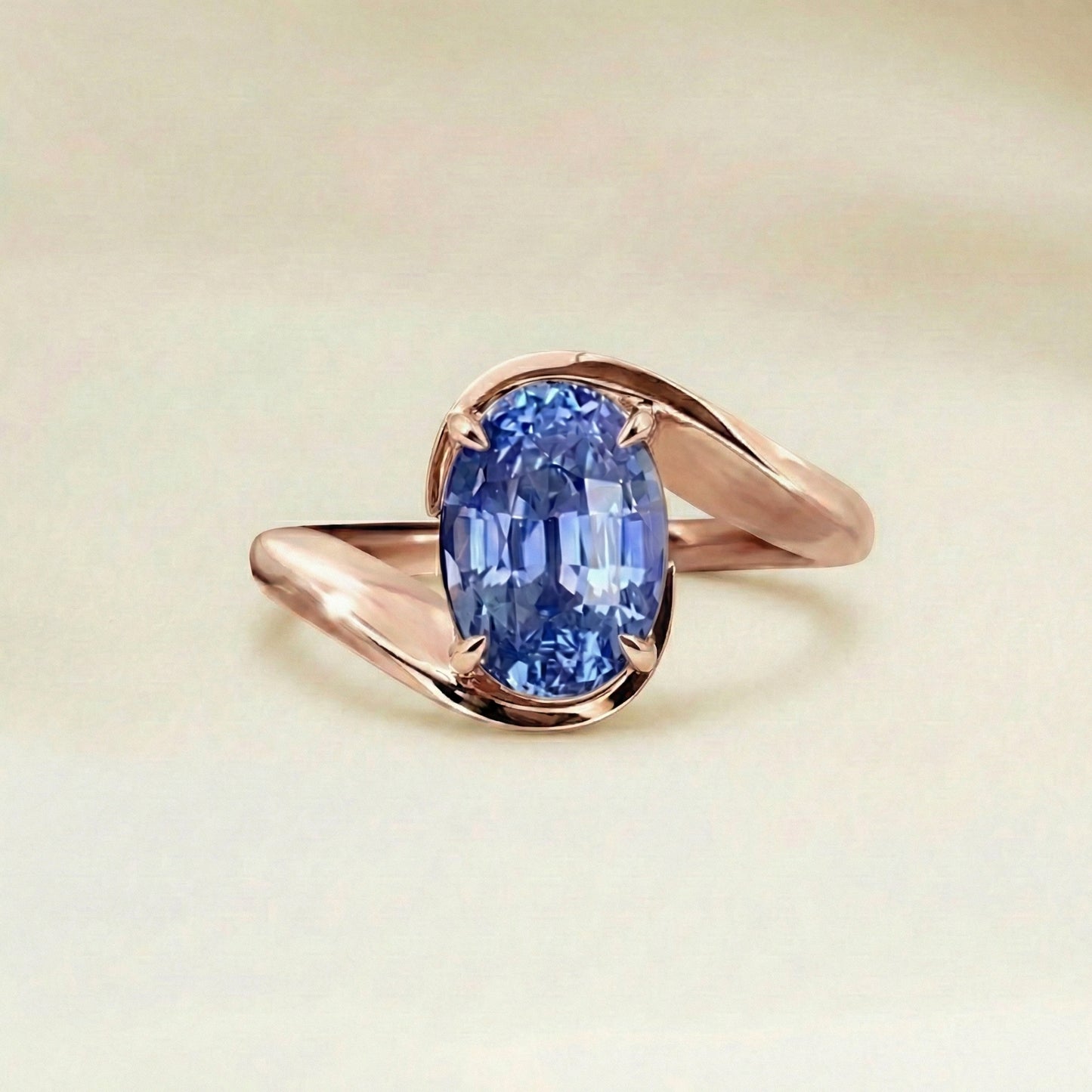 Bague solitaire saphir bleu oval or rose