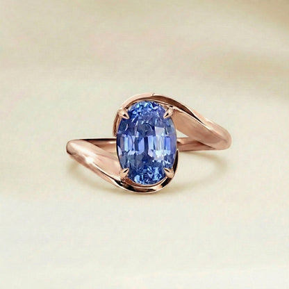Bague solitaire saphir bleu oval or rose