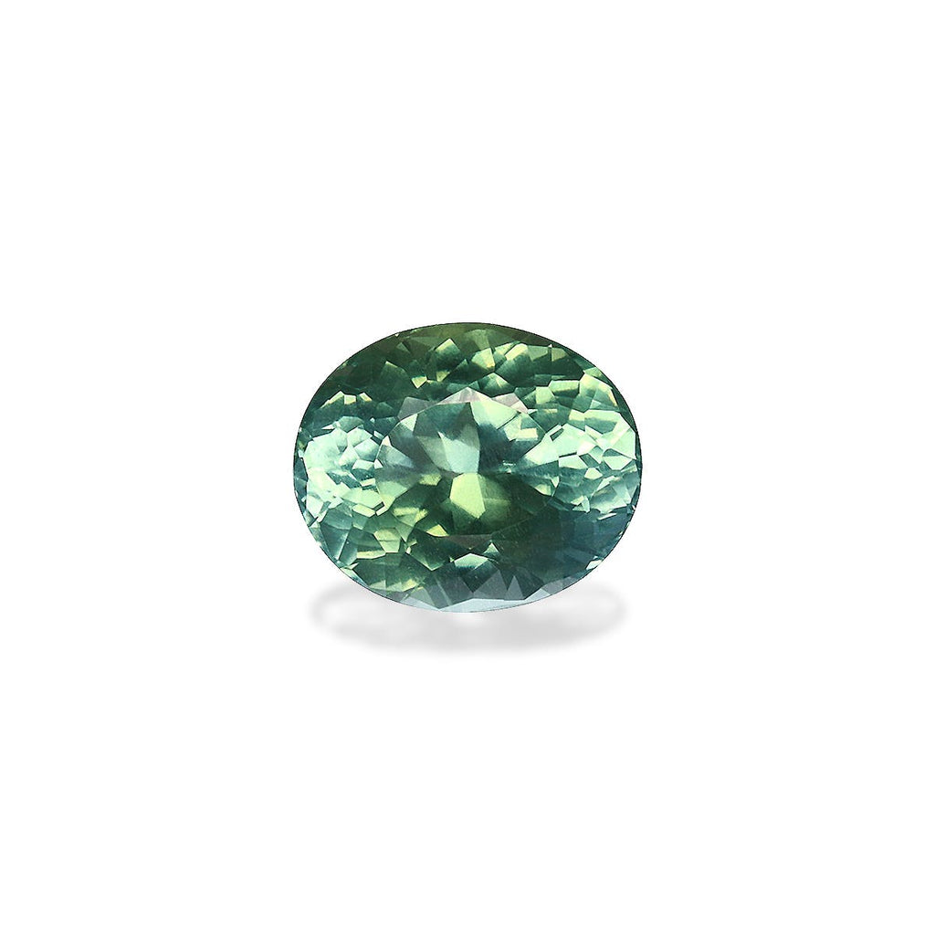 La tourmaline Paraïba de 1,22 carat de Bonnot Paris, avec sa surface verte ronde et facettée provenant du Mozambique, est sertie sur un fond blanc. Chaque éclat met en valeur ses facettes complexes, évoquant le charme envoûtant de la tourmaline Paraïba.