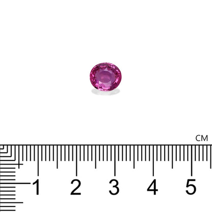 Le Saphir Rose · 2,03ct de Bonnot Paris est une petite pierre précieuse rose ronde présentée sur un fond blanc au-dessus d'une règle centimétrique, semblant mesurer environ 0,5 cm de diamètre.