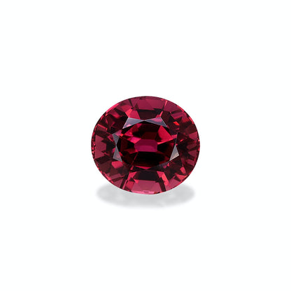 La Tourmaline Rose · 6,18 ct de Bonnot Paris, une pierre précieuse rouge à facettes rondes, est présentée sur un fond gris clair avec des teintes pourpres profondes et des facettes chatoyantes formant un motif élégant et symétrique.