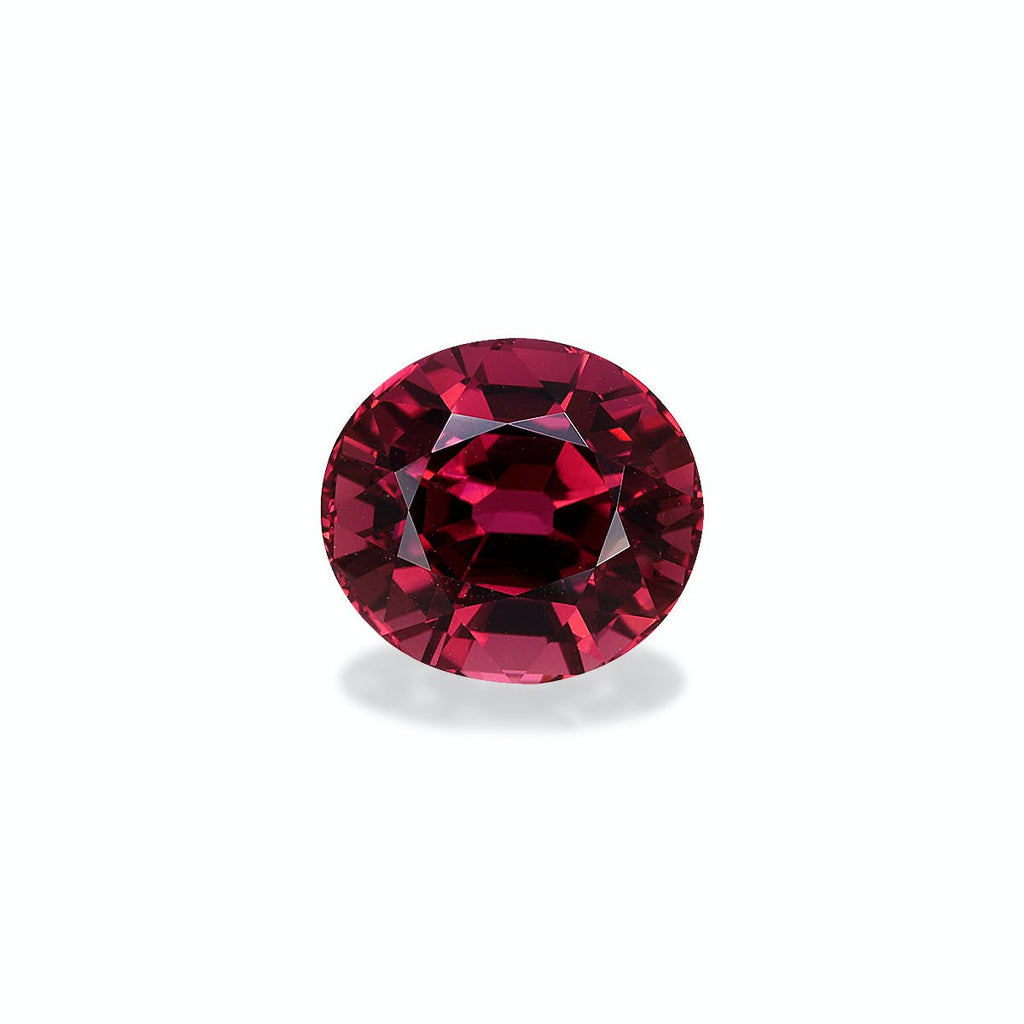La Tourmaline Rose · 6,18 ct de Bonnot Paris, une pierre précieuse rouge à facettes rondes, est présentée sur un fond gris clair avec des teintes pourpres profondes et des facettes chatoyantes formant un motif élégant et symétrique.