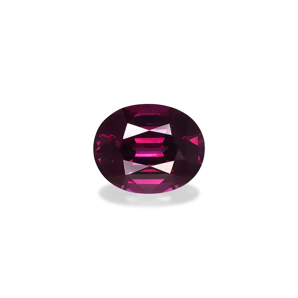 Une pierre précieuse Grenat Umbalite ronde, taillée en facettes, de couleur violet foncé et pesant 4,82 ct de Bonnot Paris, reflète la lumière et projette une petite ombre sur un fond blanc.