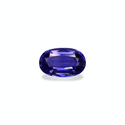La Tanzanite Bonnot Paris, une pierre précieuse de taille ovale de 6,8 ct aux reflets violets profonds, est présentée sur un fond clair, mettant en valeur ses facettes et son éclat.