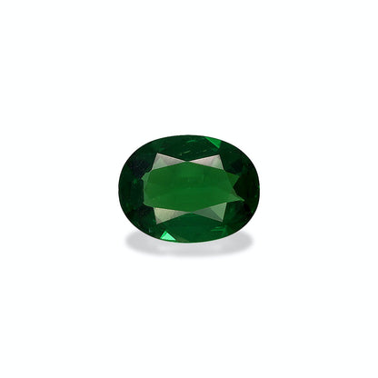 Une Grenat Tsavorite de forme ovale de 0,88 ct de Bonnot Paris, vert foncé avec une surface facettée, est centrée sur un fond blanc uni, projetant une ombre subtile en dessous.