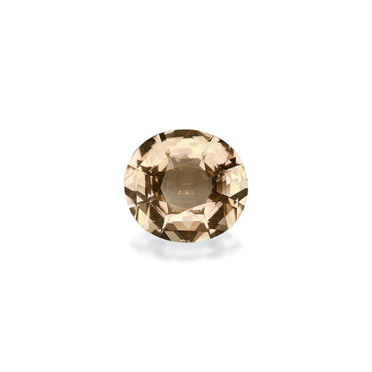 La Tourmaline Jaune de Bonnot Paris est une pierre précieuse ronde facettée de 5,98 carats, d'une teinte brun clair, posée sur un fond gris clair uni. Elle scintille subtilement, projetant une ombre subtile en dessous.